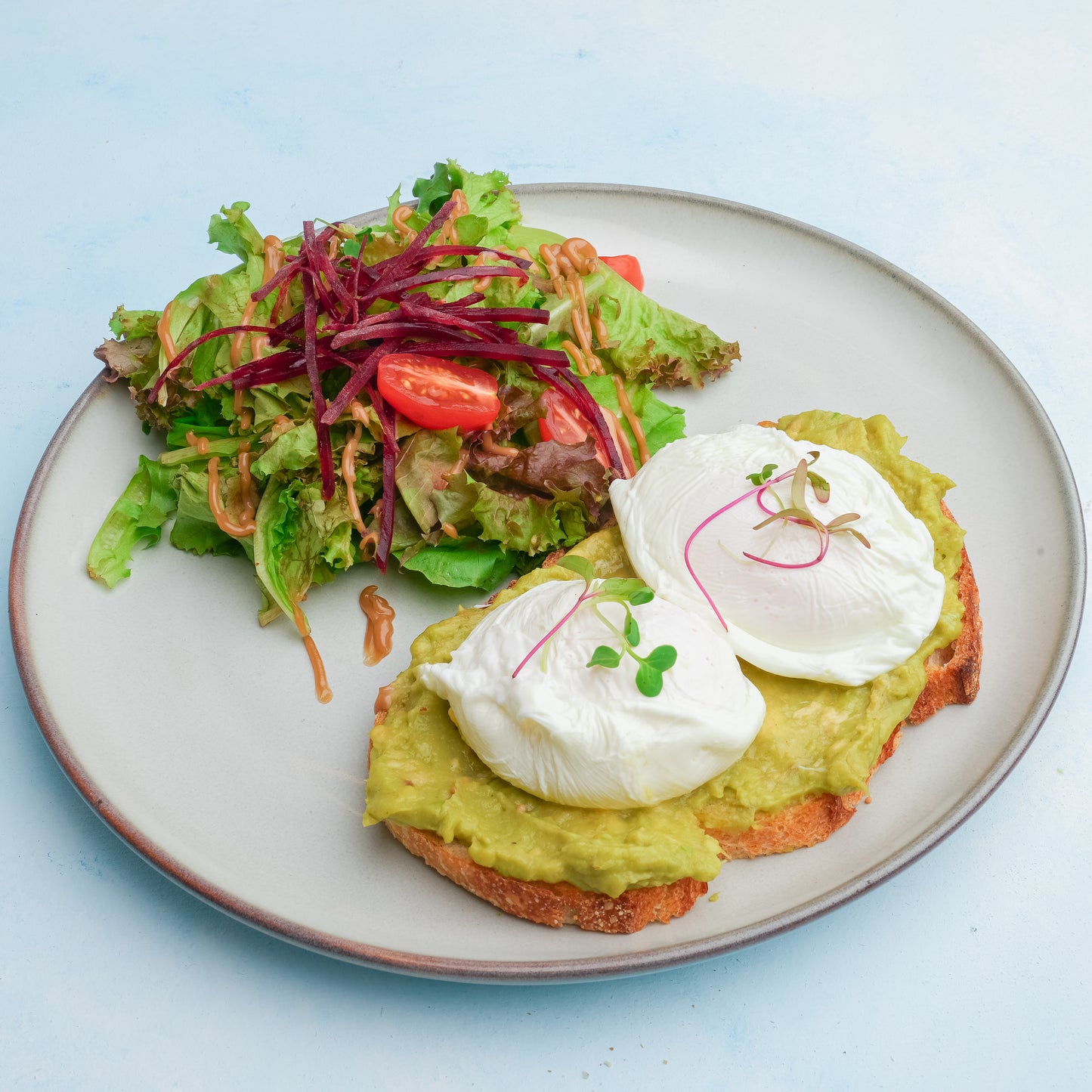 avocado toast with two poached eggs